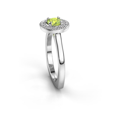 Anello di alone del platino di alone con un grande Peridot abbracciato dalle più piccole pietre preziose graduate