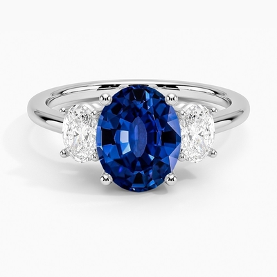Sapphire Capella Three Stone Lab creata laboratorio CZ Ring Set con lo zaffiro creato laboratorio ovale blu di 9x7mm
